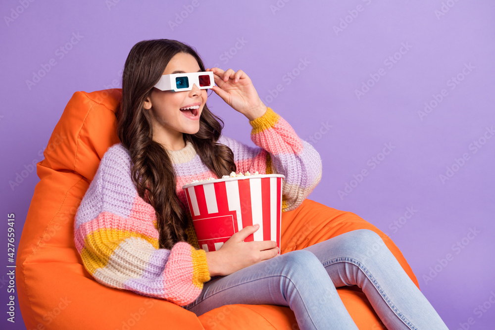 Profile side photo of young excited girl happy smile watch film 3d glasses eat popcorn isolated over violet color background