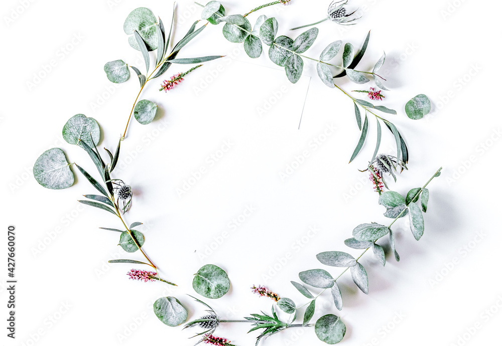 Naklejka premium floral concept with green leaves on white background top view mock-up