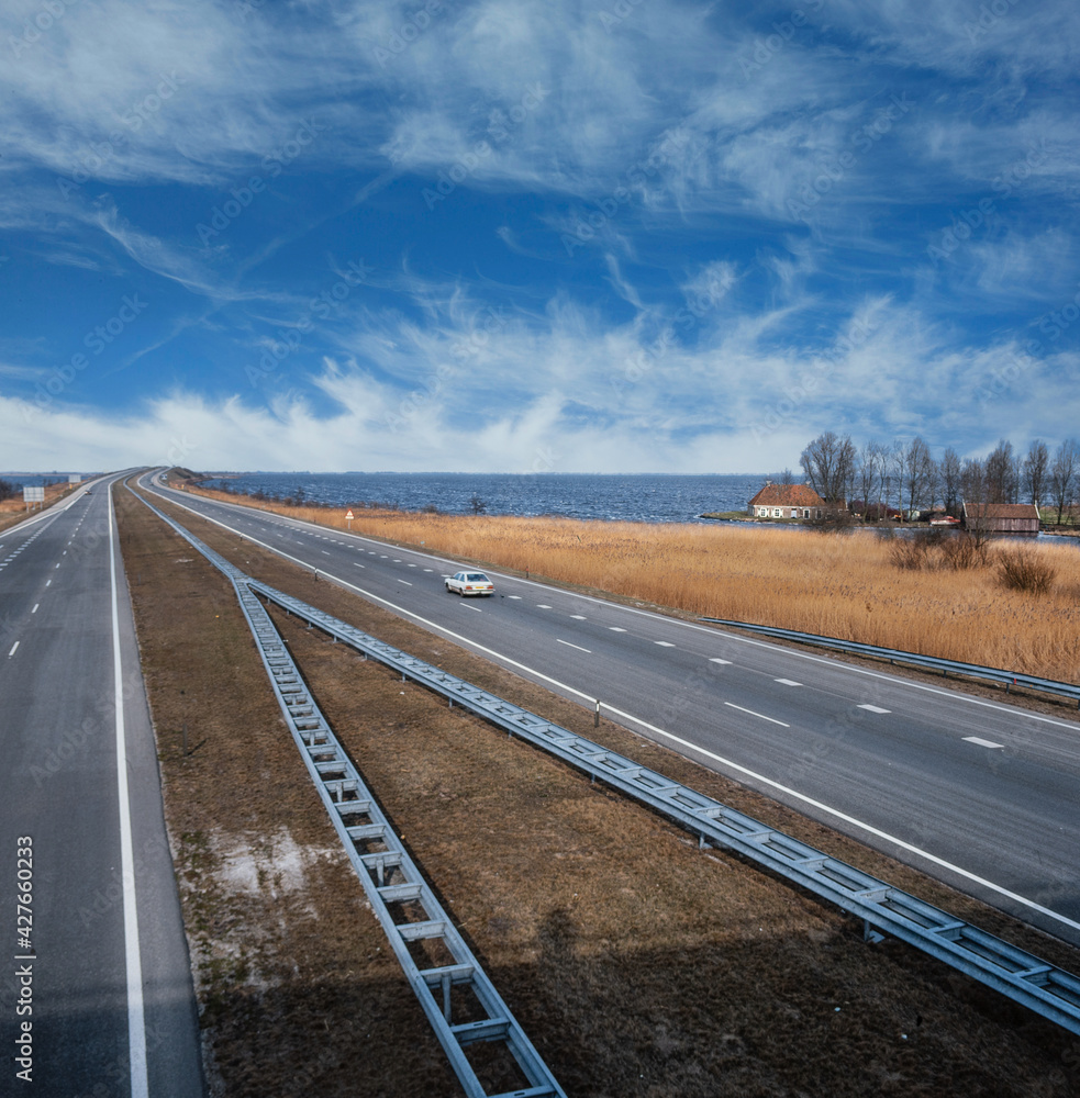 Highway with two lanes near Tjeukemeer Oosterzee Lemmer Friesland Netherlands in 1985