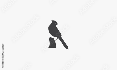 Obraz na plátně Cardinal perched on the rock icon design vector.