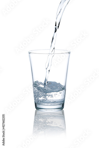 Blue tone photo pour drinking water into glass