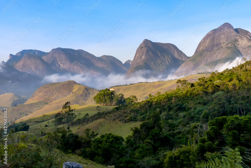 Region of the Buraco do Ouro valley, overlooking the mountains of Vale do Frade, with fog forming, city of Teresopolis, state of Rio de Janeiro, Brazil Region of the Buraco do Ouro valley, overlooking the mountains of Vale do Frade, with fog forming, city of Teresopolis, state of Rio de Janeiro, Brazil
