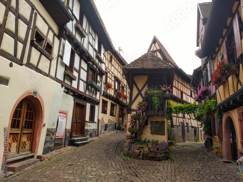 The picturesque streets of Eguisheim, Alsace. Central square with the fountain in Eguisheim. France.  © kalinaivanova