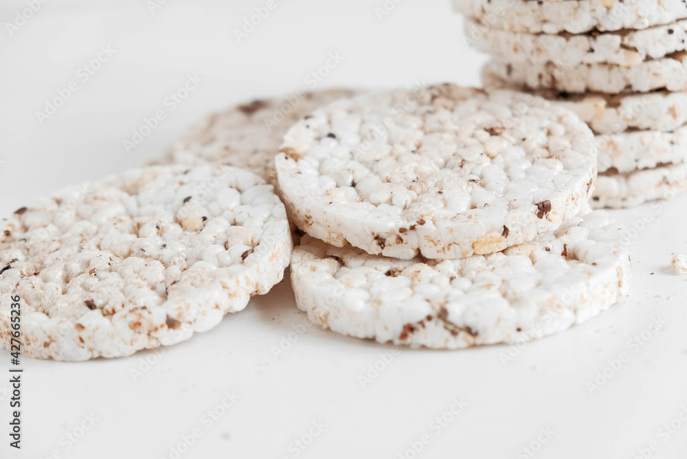 Round diet crispbreads on a white background. Round shaped cereal bread, healthy food without yeast. Copy, empty space for text Round diet crispbreads on a white background. Round shaped cereal bread, healthy food without yeast. Copy, empty space for text