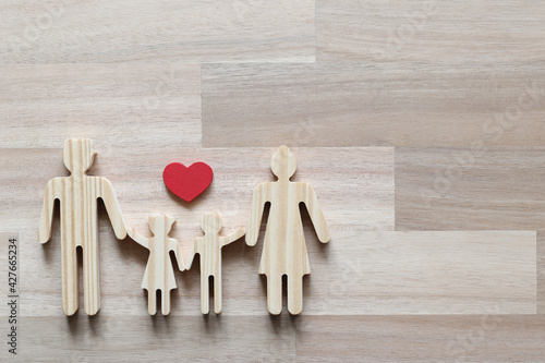 Happy family with Red heart on wooder background,Health care and insurance concept photo