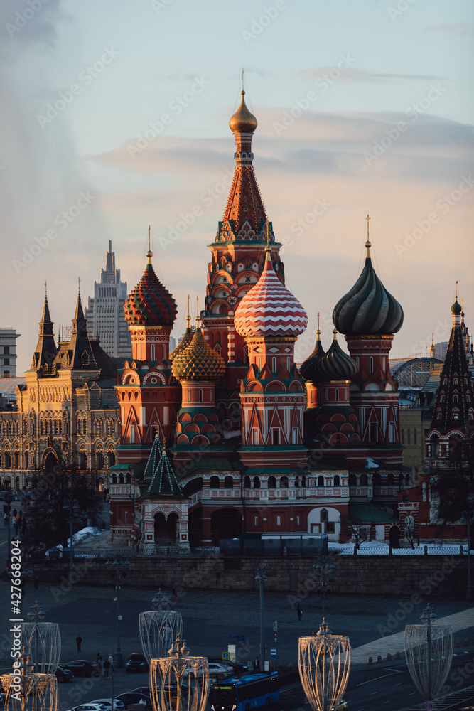 Moscow. St Basil's Cathedral on Red Square. Ancient Moscow Kremlin is the main tourist attraction of city. Beautiful view of city on sunset. Moscow. St Basil's Cathedral on Red Square. Ancient Moscow Kremlin is the main tourist attraction of city. Beautiful view of city on sunset.