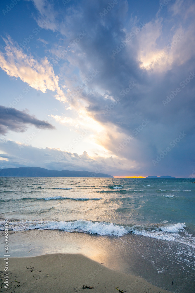 Beautiful sunlight with clouds at sunset in the Mediterranean Sea.