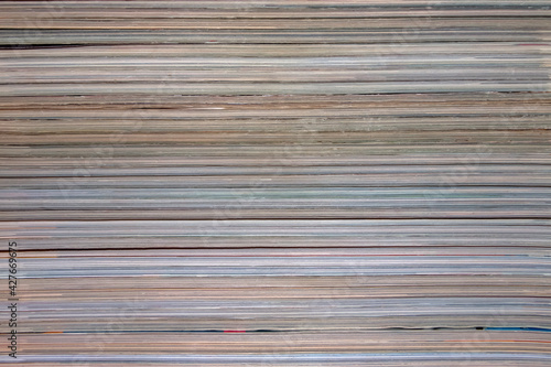 Background, texture of a stack of magazines.