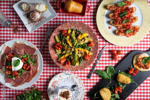 Panorama of Italian food. Various salad, skewer and dessert dishes.