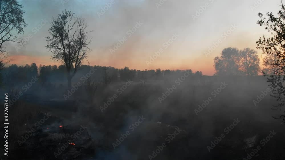 Air pollution caused by fire on dump site. Clouds of smoke above the waste land, aerial footage. Fire reasons in spring 2020. landfill fire, waste disposed of in a landfill ignites and spreads Air pollution caused by fire on dump site. Clouds of smoke above the waste land, aerial footage. Fire reasons in spring 2020. landfill fire, waste disposed of in a landfill ignites and spreads