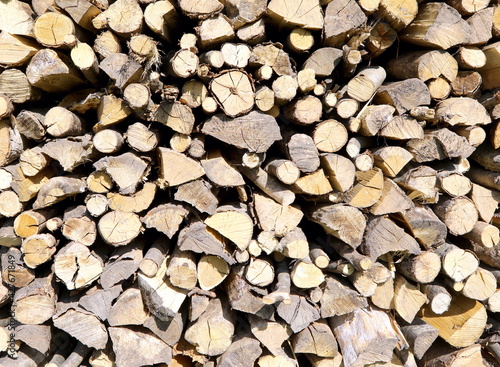 pieces of wood for burning stacked in a woodshed