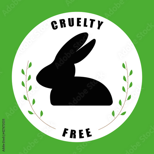 Illustration of rabbit silhouette with branches with leaves around it with the word Cruelty Free. Green background.