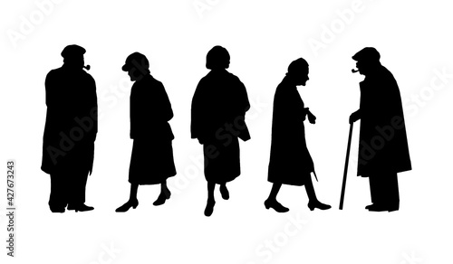 Silhouettes of old people, men and women in coats.