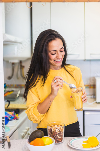 vegan woman eating a healthy smoothie