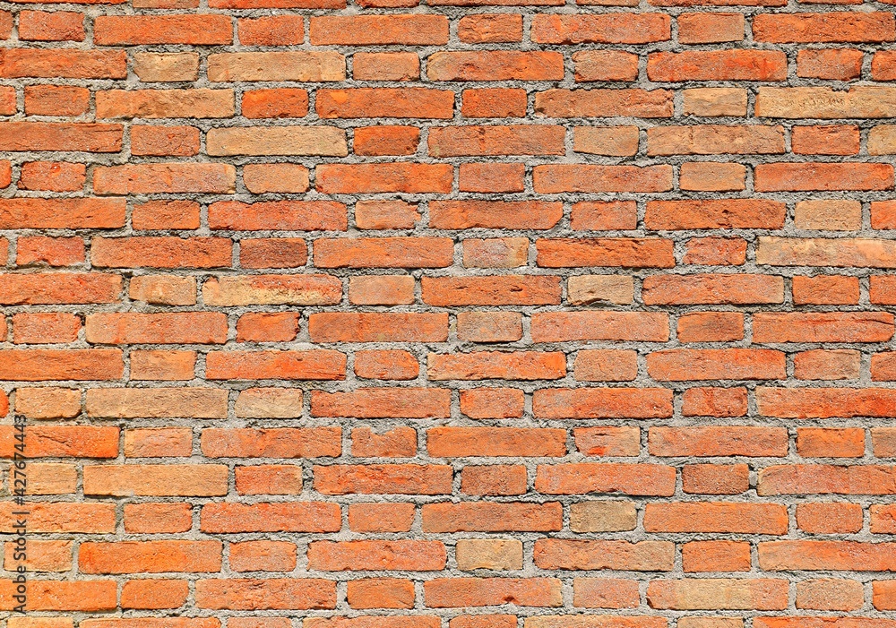 Naklejka premium wall made with red bricks and mortar