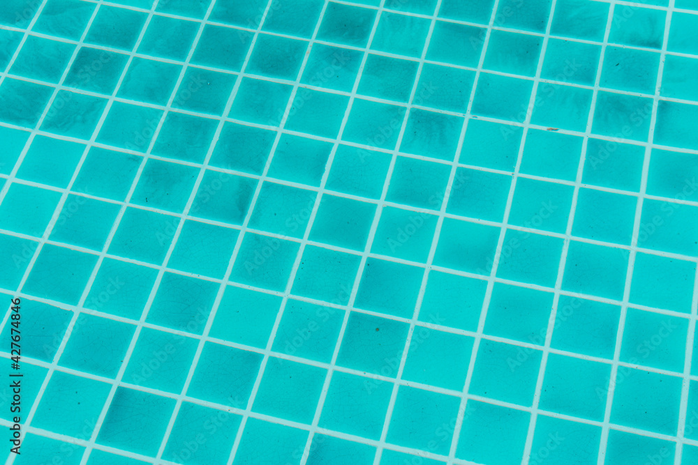 The blue texture of surface in the blue pool is clean, summer blue wave abstract or natural rippled water texture background, Swimming pool tile floor. The blue texture of surface in the blue pool is clean, summer blue wave abstract or natural rippled water texture background, Swimming pool tile floor.