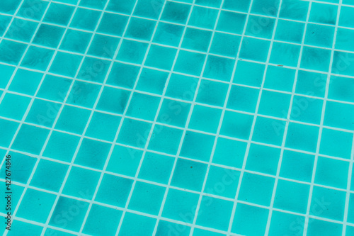 The blue texture of surface in the blue pool is clean  summer blue wave abstract or natural rippled water texture background  Swimming pool tile floor.