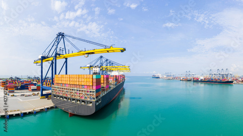 ear view cargo container ship. Business logistic transportation sea freight, Cargo container in deep sea port at industrial, Cargo ship, Crane And Unloading Containers