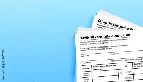 Coronavirus vaccination record card on blue background with copy space for travel and movement without borders. Vaccination form during the coronavirus covid 19 epidemic