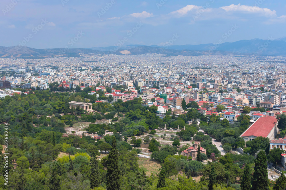 View of the Athens and the ancient Temple of Hephaestus, a doric greek temple in the north-west side of the Agora of Athens, Greece. View of the Athens and the ancient Temple of Hephaestus, a doric greek temple in the north-west side of the Agora of Athens, Greece.