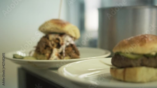 Delicious burgers samplers in luxury restaurant kitchen, camera dolly photo