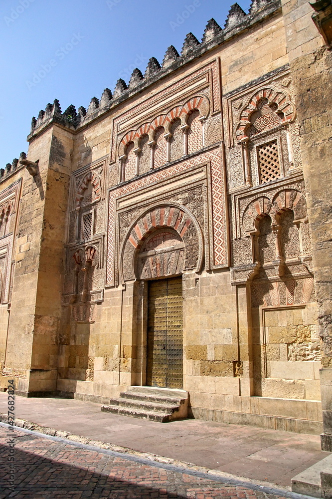 Decorated door and wall of the mosque cathedral in Cordoba, Spain