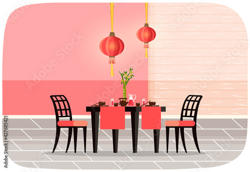Restaurant in chinese style interior design. Served table with food from China and dishes