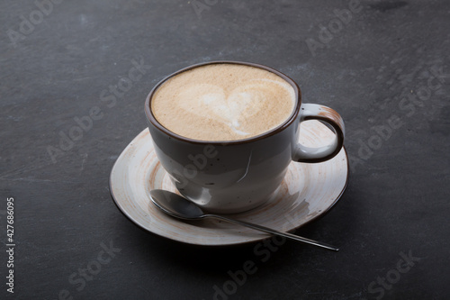 Cup of fresh cappiccino coffee with foam