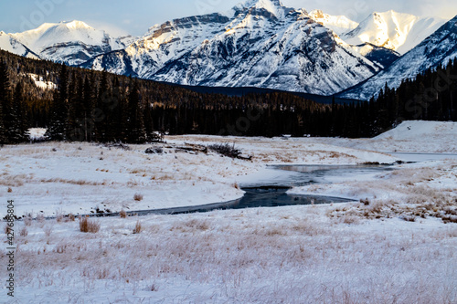 Creek flowing to the Paliser Range in a valley. Banff National Park, Alberta, Canada