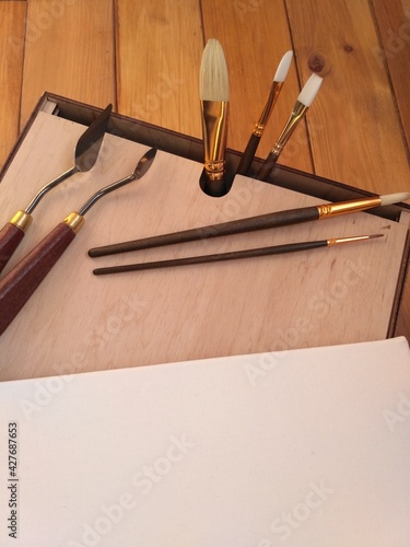 tools for painting on the wooden box