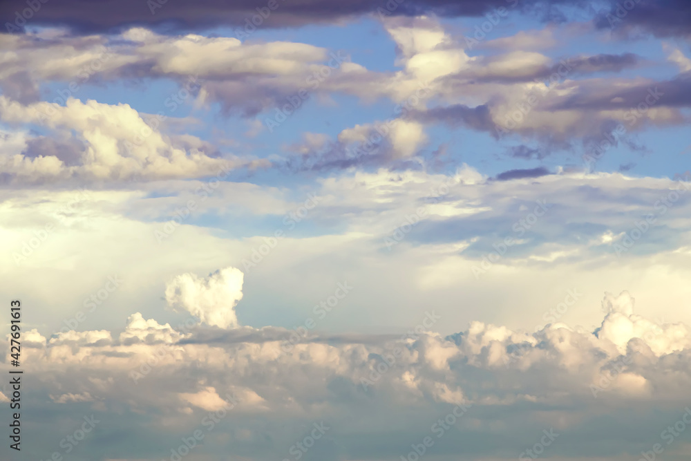 White heart shaped cloud surrounded by dark clouds White heart shaped cloud surrounded by dark clouds