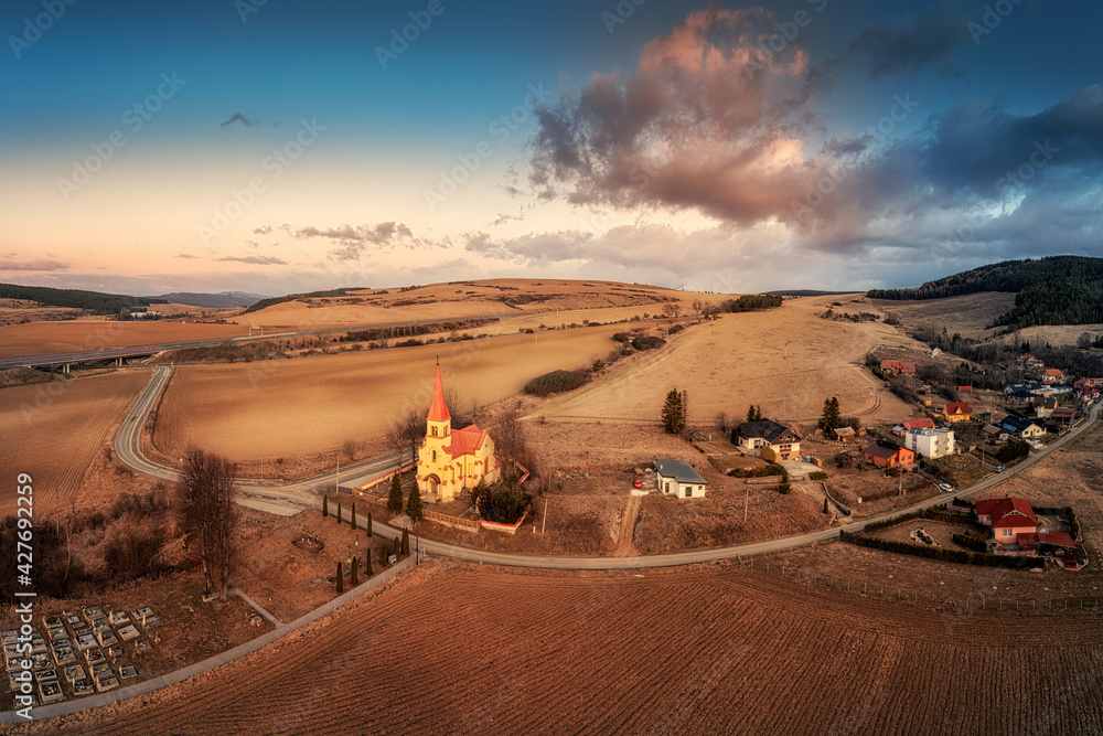church in the village of Cencice at sunset church in the village of Cencice at sunset