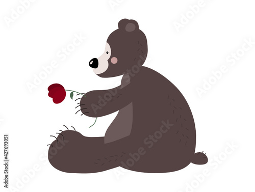 Cute brown bear. A funny fairy-tale animal. Color children's vector illustration in a flat style. Cartoon bear. With a red flower.
