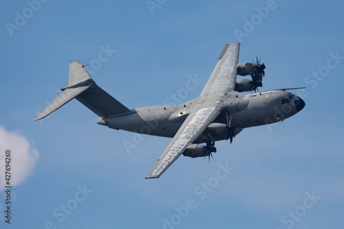Military transport plane. Aircraft without title at airport. Aviation theme. In flight. Flying.