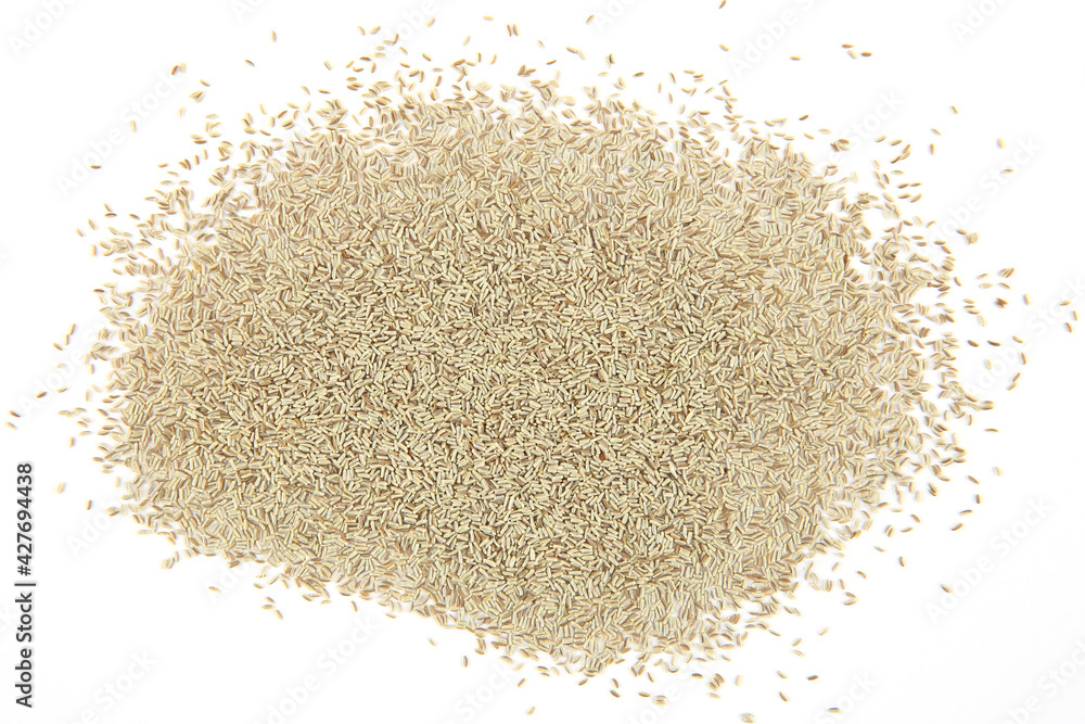 Chamomile flowers seeds isolated on white background. Pile dry Matricaria chamomilla flowers seeds, top view. Chamomile flowers seeds isolated on white background. Pile dry Matricaria chamomilla flowers seeds, top view.