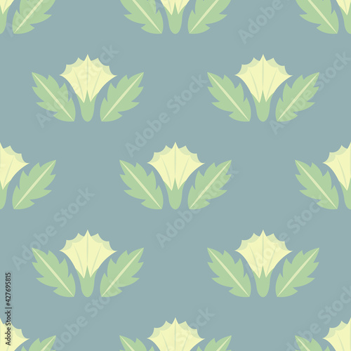 Datura flowers seamless pattern with leaves in yellow-green colors in geometric style.