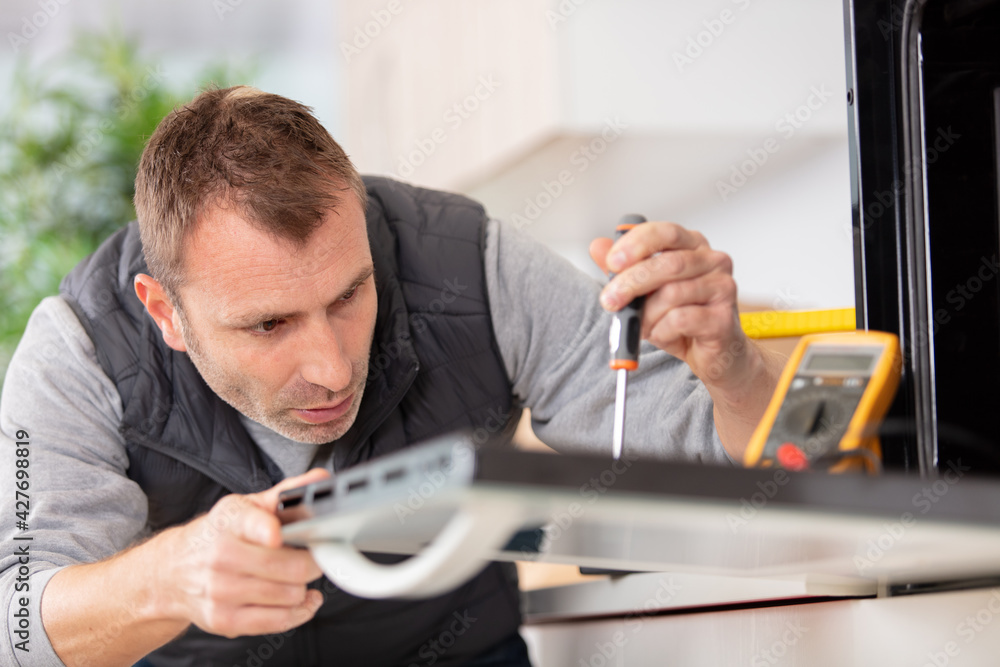 expert panel fixing the kitchen oven in a new apartment expert panel fixing the kitchen oven in a new apartment
