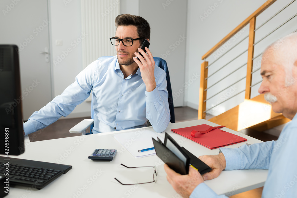 young and senior worker in office young and senior worker in office