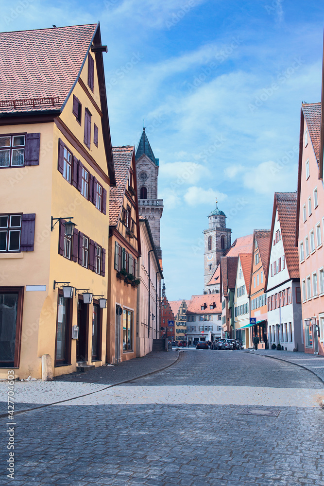 beautiful colored houses and stately cathedrals along an old cobbled street in the small German town of Harburg
