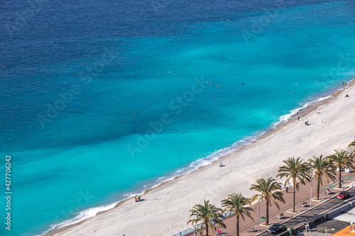 emerald color sea mediterranean and a beach in Nice, south France Europe. blue interior idea.