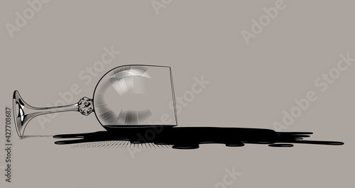 Inverted transparent wine glass and stain of spilled wine