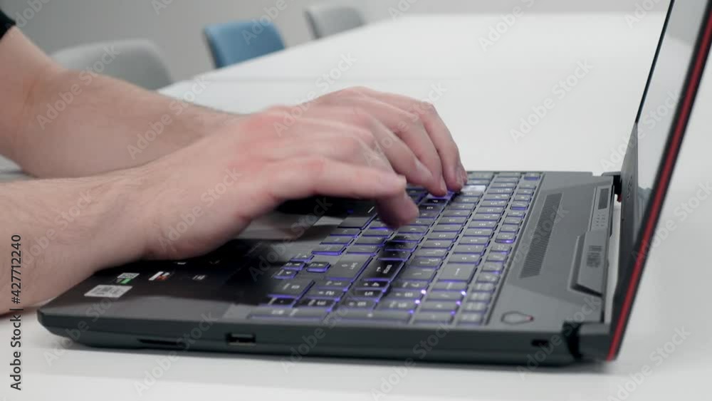 Typing on Gaming Laptop with Backlit Keyboard Typing on Gaming Laptop with Backlit Keyboard