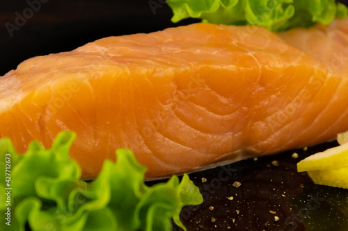Lightly salted salmon steak with herbs and lemon