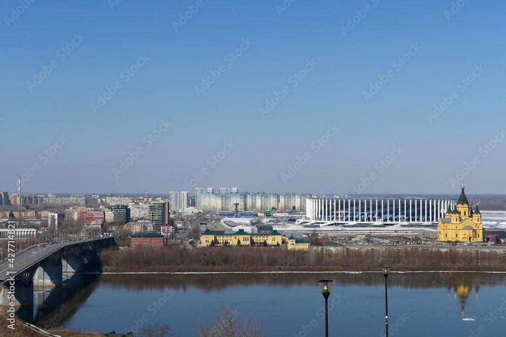 City panorama. A modern city, a metropolis on the river bank and a beautiful bridge over the river. High quality