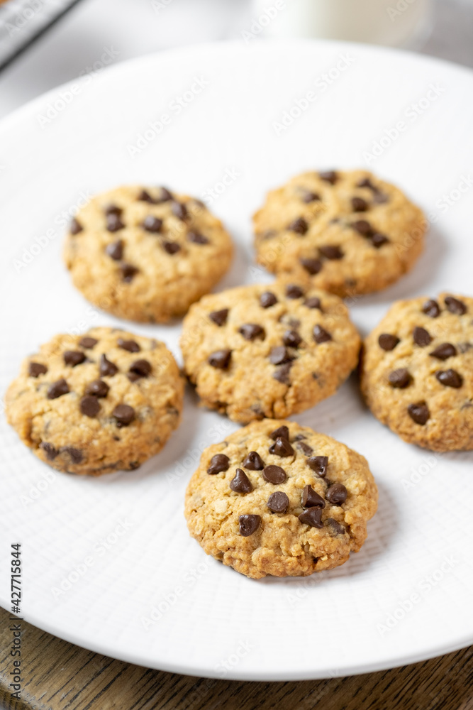 Delicious Whole Wheat Chocolate Chip Cookies set on white cafe table. Delicious Whole Wheat Chocolate Chip Cookies set on white cafe table.