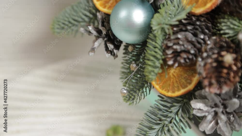 Woman florist makes new year compositions. Woman florist makes new year compositions.