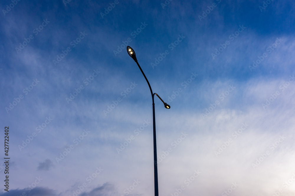LED lighting of street lamps against the blue sky. LED lighting of street lamps against the blue sky.