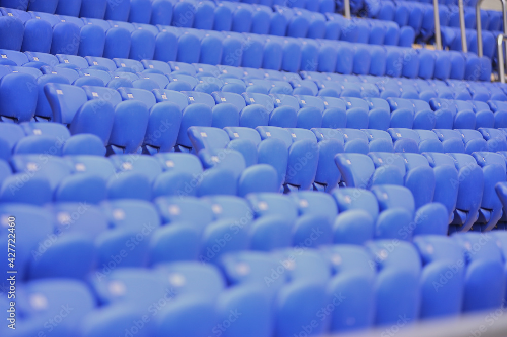 Naklejka premium The empty blue plastic seat at stadium.