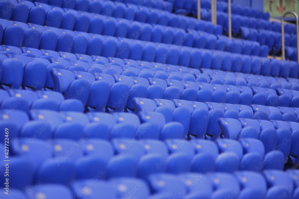 Fototapeta premium The empty blue plastic seat at stadium.