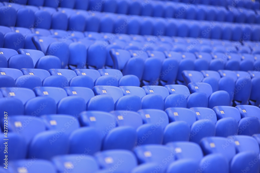 Fototapeta premium The empty blue plastic seat at stadium.